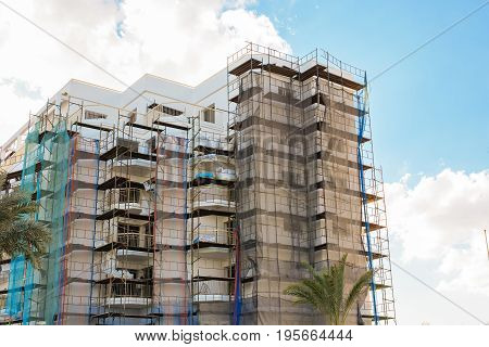 Protaras, Cyprus - February, 15, 2017. Construction's cars working on the construction of a new hotel in Protaras. Urban scene