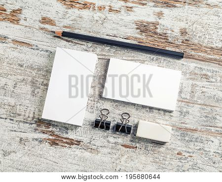 Corporate identity template. Blank stationery set. Mock-up for branding identit. Bank business cards pencil and eraser on vintage wood background. Top view.