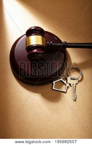 gavel hammer and key ring with house shape