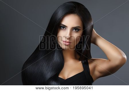 Beautiful Model Girl With Smooth Dark Hair. Perfect Hair. Black Dress