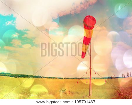 Film Grain. Summer Hot Day On Sport Airport With Abandoned Windsock, Wind Is Blowing And Windsock Is