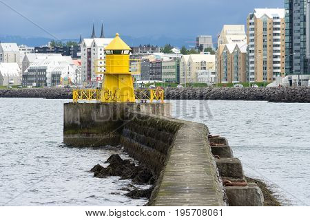View over Reykjavik harbor with one of the old harbor heads in the center of the view Iceland