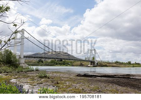 Laugaras Bridge is a suspension bridge and road bridge that was completed in 1958. The river is the river Olfusa