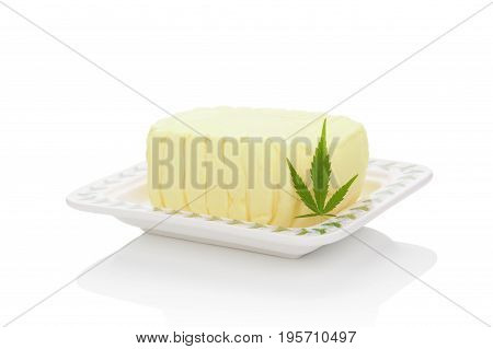 Delicious marijuana butter with marijuana leaf isolated on white background. Alternative medicine.