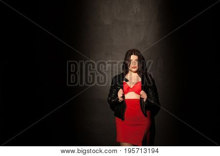fat woman in red underwear in black room 1