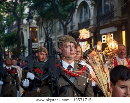 June 19 2017. Spanish soldiers march alongside priests and children during the procession of Corpus Christi. Valencia Spain. Religion and military editorial concept.