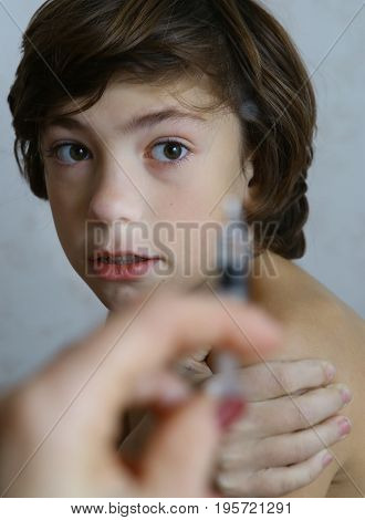 Teenager Boy Afraid Of Syringe Injection Vaccination