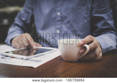 Man Hand Using Application In Tablet For Working At Cafe. Vintage Tone