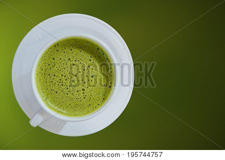 hot greentea healthy drink water on green background