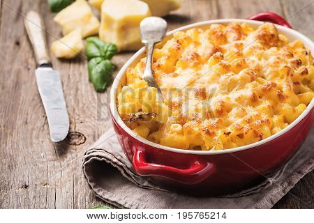 Mac and cheese, american style macaroni pasta in cheesy sauce