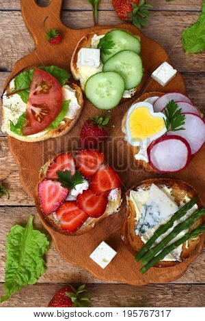 Set Of Healthy Whole Wheat Bread Sandwiches With Fuits, Vegetables, Cheese And Leafy Green Herbs On