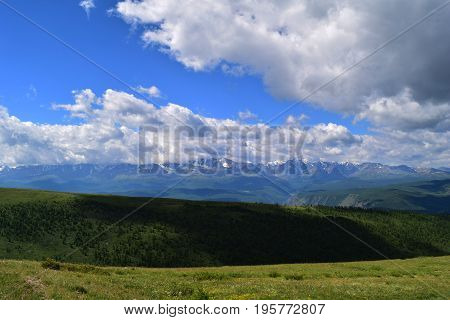 Snow peaks of North-Chuysky ridge and Kurai steppe in Altai mountains. Altay Republic Siberia Russia.