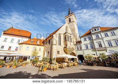 Morning view on the Wenige Square with the old church in Erfurt city, Germany