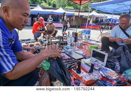 Keningau,Sabah,Malaysia-June 29,2017:Local people buying various electronic street shop at the local market Tamu in Keningau,Sabah.In Tamu there are many cheaper Chinese electronic gadget for sale.