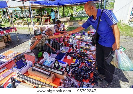 Keningau,Sabah,Malaysia-June 29,2017:Local people buying various electronic street shop at the local market Tamu in Keningau,Sabah.In Tamu there are many cheaper Chinese electronic gadget for sale.