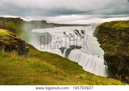 Gullfoss waterfall in Golden Circle popular tourist route in the canyon of the Hvítá river in southwest Iceland.Long exposure panorama of beautiful popular iconic Gullfoss cascade fall.