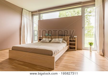 Big Bed With Beige Duvet