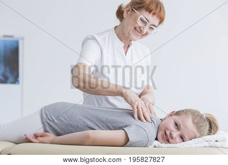 Girl Lying On Physiotherapy Table