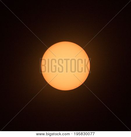 Sun with sunspot at 4 o'clock position