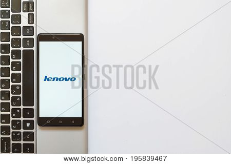 Los Angeles, USA, july 18, 2017: Lenovo logo on smartphone screen placed on the laptop on white background.
