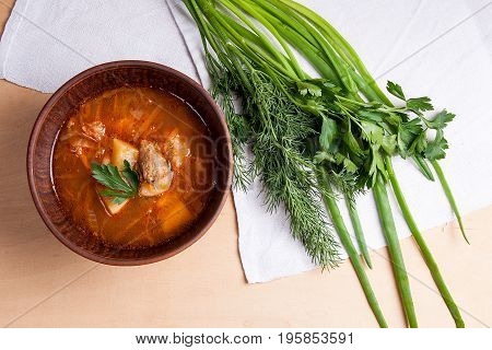 Borsch - Traditional Ukrainian And Russian Red Beetroot Soup With Red Beets In Clay Bowl On Wooden B