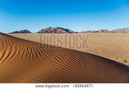 Sand waves in Elin dune at dusk Namibia