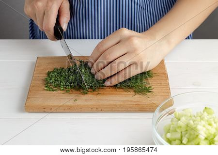 Step By Step Recipe For Tarator. Hands Cut A Dill On Board In The Kitchen.