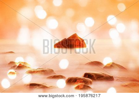 Film Effect. Romantic Morning At Sea. Big Boulders Sticking Out From Smooth Wavy Sea. Pink Horozon W