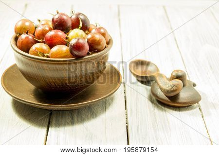 Berries In Rural Dishes. Berries On A White Background.