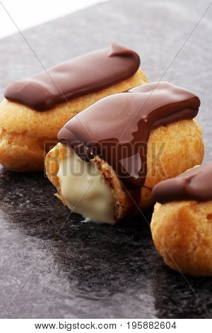Traditional French Dessert. Eclair With Chocolate Icing. Pastery