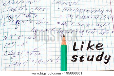 A simple pencil lies on the school note in mathematics near the inscription in English like study