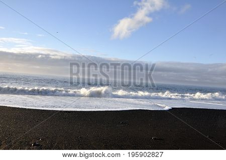Black lava beach on a beautiful day iceland