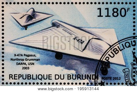 Moscow Russia - July 17 2017: A stamp printed in Burundi shows aircraft Northrop Grumman X-47A (2003) - a demonstration Unmanned Combat Aerial Vehicle series 