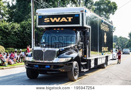 DUNWOODY GEORGIA - July 4 2016: Participants and spectators in the annual Dunwoody Georgia 4th of July parade which attracts over 2500 participants and 32000 spectators
