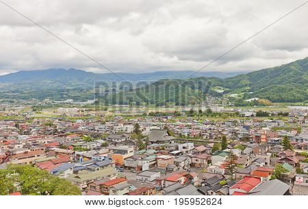 KAMINOYAMA JAPAN - MAY 28 2017: View of Kaminoyama City from donjon of Kaminoyama Castle. Modern town of Kaminoyama was established in 1889 and was elevated to city status in 1954