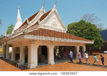 LOEI, THAILAND - APRIL 18, 2010: Unidentified people visit Phra That Si Song Rak temple in Loei, Thailand.