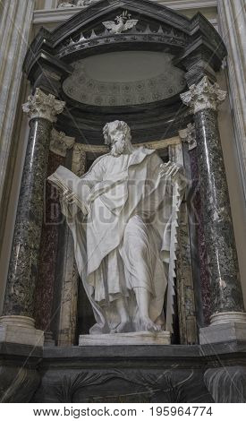 A marble statue disciple of Jesus the Apostle of St. Simon in Basilica di San Giovanni in Laterano (St. John Lateran basilica) in Rome. Rome Italy June 2017
