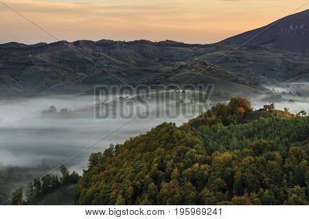 Autumn nature with misty landscape, Holbav village, Carpathians, Transylvania Romania Europe
