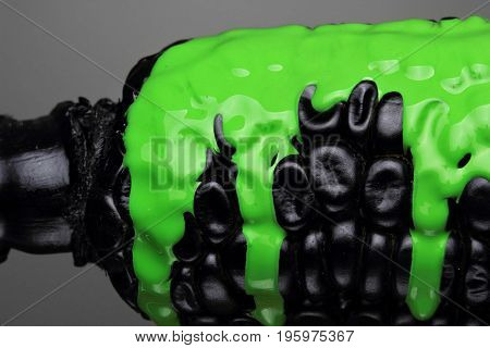 Black Corn With Pouring Green Paint Background, Macro Closeup.texture