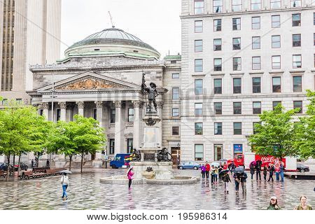 Montreal, Canada - July 26, 2014: Old Town Area With Centaur Theater And Statue Outside Notre Dame B