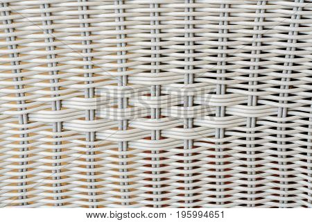 Close up synthetic white rattan weaving the seat of a chair