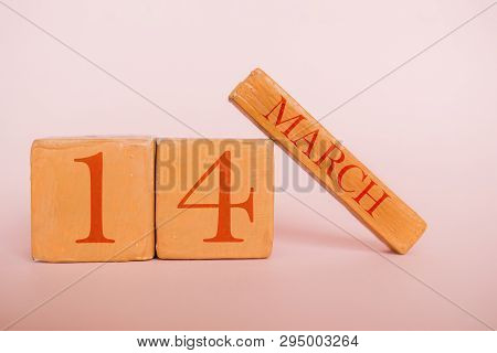 March 14th. Day 14 Of Month, Handmade Wood Calendar  On Modern Color Background. Spring Month, Day O