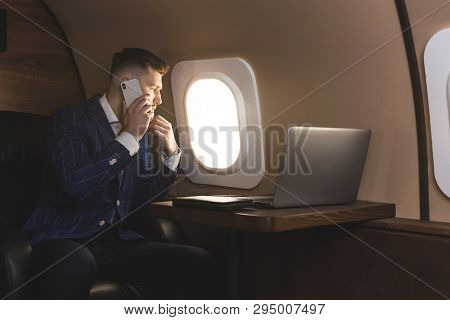 Attractive And Successful Businessman In An Expensive Suit Working Sitting In The Chair Of His Priva