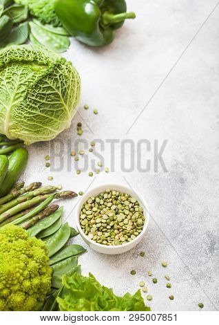 Assorted Green Toned Raw Organic Vegetables On White Background. Avocado, Cabbage, Broccoli, Caulifl