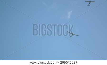 Aviation Holiday . The Aircraft Towed On A Cable Lifts Into The Sky A Non-motorized Glider.