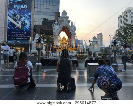 Bangkok, Thailand - April 16, 2018: Religious People Pray Near Buddist Shrine In The City Centre Wit
