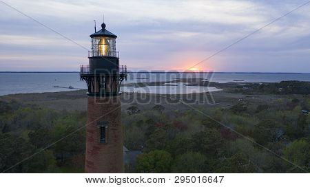 Sun Setting At Currituck Lighthouse Outer Banks North Carolina
