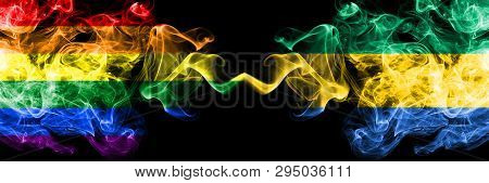 Gay Vs Gabon, Gabonese Smoke Flags Placed Side By Side. Thick Colored Silky Smoke Flags Of Pride And