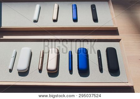 New Design Iqos. Showcase With A Large Multi-colored Selection System Of Heating Of Tobacco. Color D
