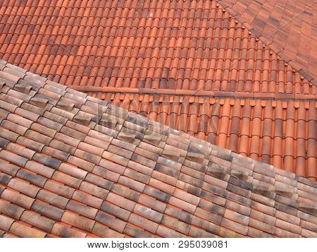 Full Frame Image Of Orange Terracotta Tiled Roofs With Diagonal Traditional Pantiles In Lines And Ro